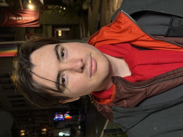 Forest standing on a city street at night, facing the camera